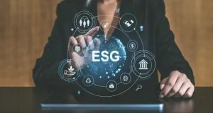 Business professional using digital ESG interface to assess sustainability performance and compliance.